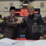 Nelson Pomalingo dan Syam T. Ase