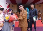Peringati Harganas ke-32, Bupati Bolmut Serahkan Bantuan ke Keluarga Berisiko Stunting